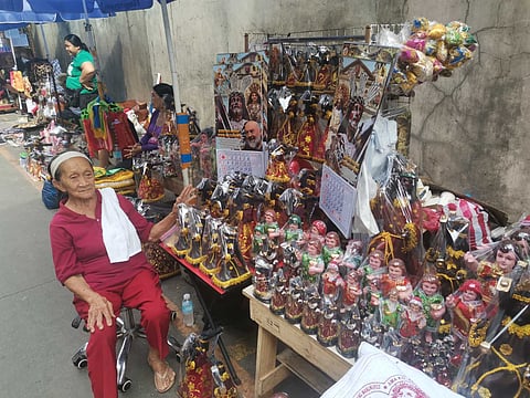 Vendor anticipates selling Black Nazarene figurines on upcoming Traslacion