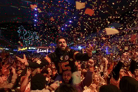 Kansas City Chiefs fans celebrate after their team beat the San Francisco 49ers in Super Bowl LVIII at the Red Kingdom Block Party in the Power and Light District on February 11, 2024 in Kansas City, Missouri.   Photo by Reed Hoffmann / GETTY IMAGES NORTH AMERICA / Getty Images via AFP