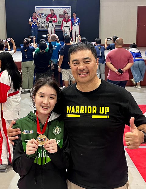 PHOTOGRAPH COURTESY OF MONSOUR DEL ROSARIO
ISABELLA del Rosario (left) is slowly stepping out of the giant shadow of his father, Monsour, following her impressive win in the taekwondo competition of the WNCAA.