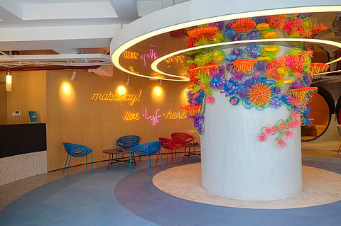 The lobby’s pillar showcases an artwork by Leeroy New using upcycled materials.