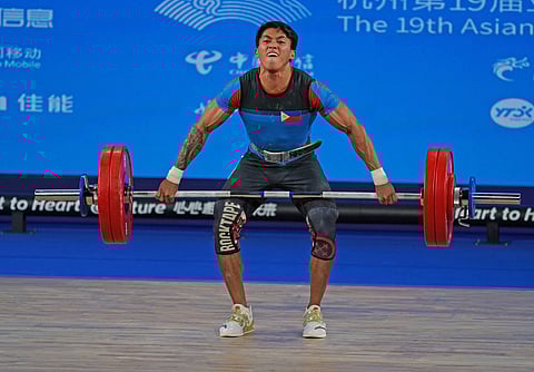 JOHN Ceniza seeks to become the first Filipino male lifter to win a medal in the Summer Olympics. | PHOTOGRAPH COURTESY
OF PSC-POC MEDIA POOL