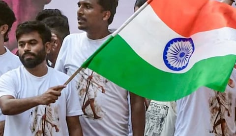 Abhijeet Dipke waving the Tiranga at CJP protest