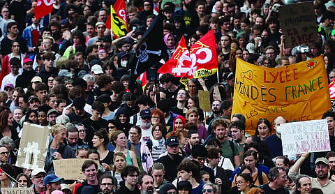 Protesters across France rally over rising costs, joining students’ protest