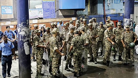 Security personnel deployed in the Chorbagan area of Kolkata following the deadly Durga Puja pandal stampede.
