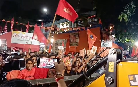 Left party workers stop a bulldozer amid tension over the removal of CPI(M) bookstalls in Kolkata’s Jadavpur area.