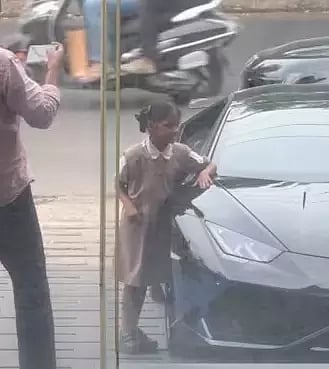 Children posing with the Lamorghini