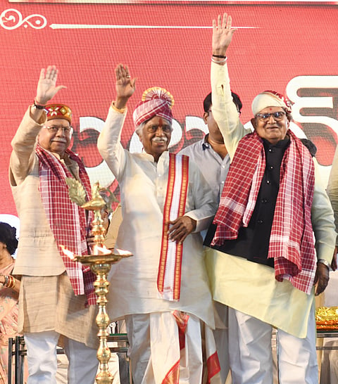 Telangana Governor Shiv Pratap Shukla, former Haryana Governor Bandaru Dattatraya, and Punjab Governor Gulab Chand Kataria waving to public at ‘Datthanna Alai Balai’ programme held at Nampally Exhibition Grounds, Hyderabad, on October 22. 