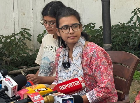 Neha Bora, AISA national president and JNU PhD scholar, addresses a press conference.