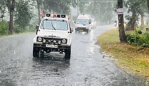 Vehicles move on a road during rains triggered by cyclone Arnab near Ranchi on Wednesday. 