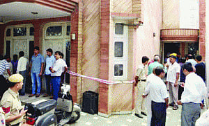 Woman relative held for murder of trader
