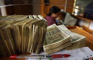 Rupee gains 85 paise to 65.70 per dollar after PM's comments