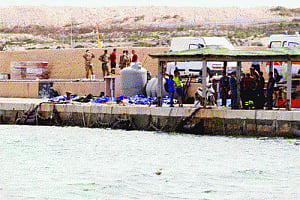 At least 94 dead in migrant shipwreck off Italy