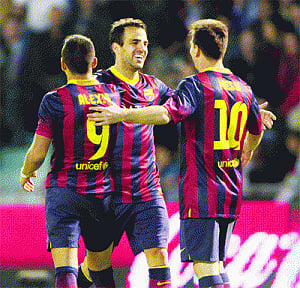 Barca consolidate lead with Fabregas double