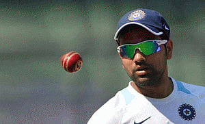 Rohit slams century on debut as India take big lead