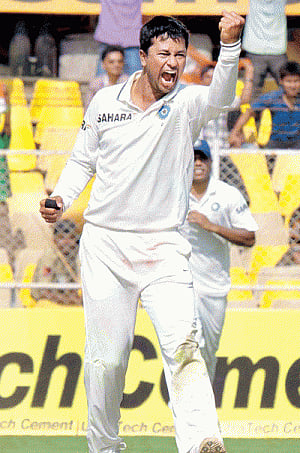 Ojha, Ashwin run through West Indies