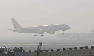 Dense fog cripples trains, flights