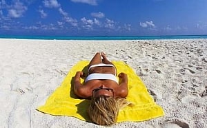 Craze for sun tanning triggered skin cancer in women?