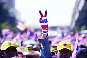 Defiant Thai protesters continue march despite deadly blast