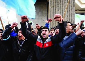 Rivals brawl in Crimea as Putin orders drills