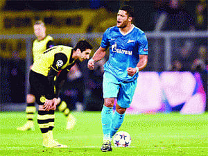 Dortmund lose but advance