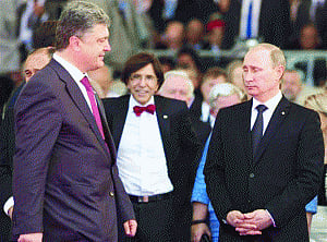 Putin, Poroshenko seek quick end to fighting