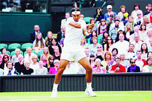 Nadal slips into gear, Sharapova on it
