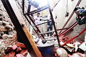 2 killed, 5 hurt in house collapses