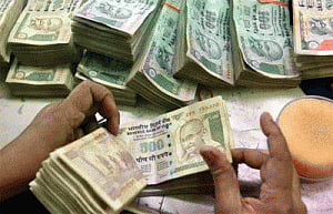 Rupee down 5 paise against dollar in early trade