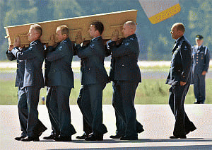 Plane carrying MH17 victims' remains arrives in Netherlands