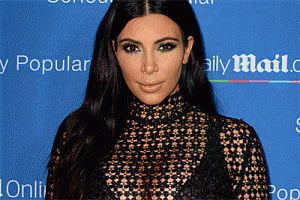 Kim Kardashian flaunts baby bump in sheer dress