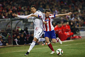 Real, Atletico play in Champions league with eye on Madrid derby