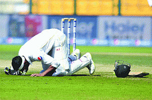 England fight after Malik's double ton