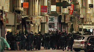 Two killed as police hunt for Paris attack mastermind