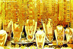 Gold plunge by Rs410 on weak global cues, low demand