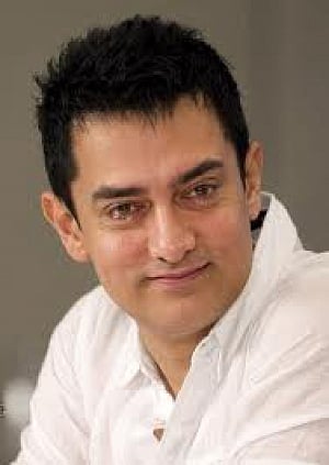 Aamir cuts vegan cake for 50th b'day with media