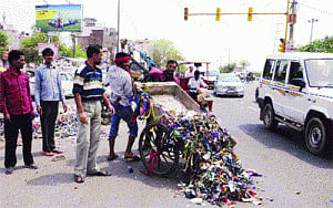 Broke civic body employees raise a stink