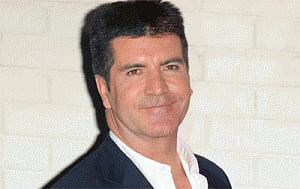 Simon Cowell warming up to idea of adoption