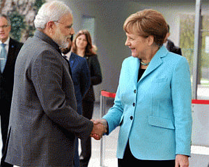Modi seeks Merkel's help in early conclusion of FTA with EU