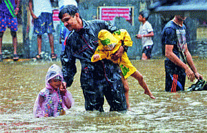 Maximum City at sea as high tide rains misery