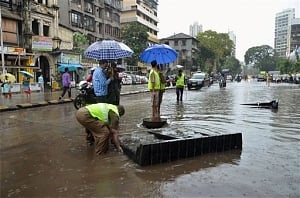 Mumbai back to work, train services restored