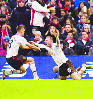 Rooney's record strike sinks liverpool