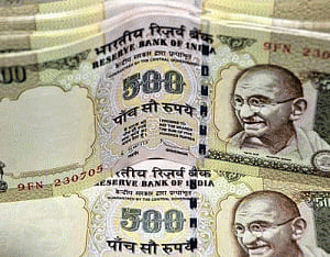 Rupee inches up 8 paise against dollar
