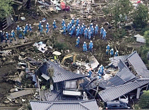 Rescuers race against landslides to reach Japan quake victims