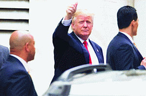 Trump cushions blow to image on Muslim ban
