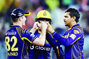 Spinners take KKR into playoffs