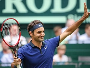 I'll be back at Wimbledon, vows beaten Federer