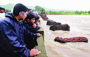 Two drown, 30 missing as British-era bridge collapses