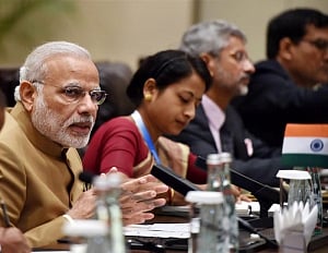 Modi holds bilateral talks with Suu Kyi, Geun-hye