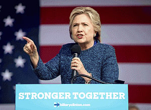 Clinton tells supporters to keep their foot on the gas
