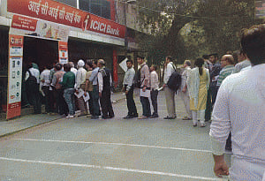 Banks, ATMs mobbed for third day